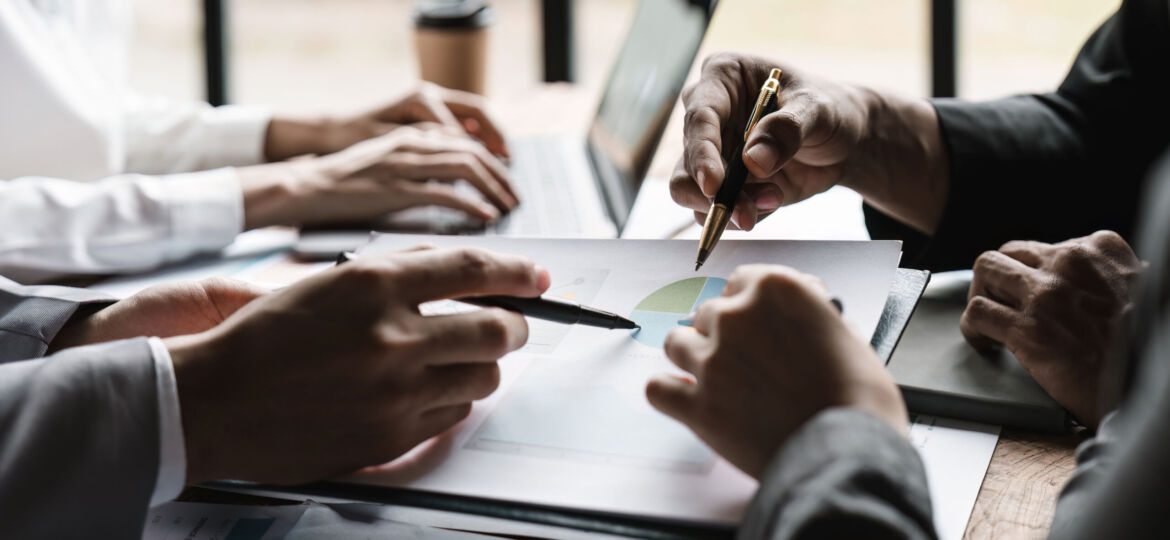 Startup business meeting to analyze and discuss the situation on the financial report in the meeting room. Investment Consultant, Financial advisor and accounting concept.