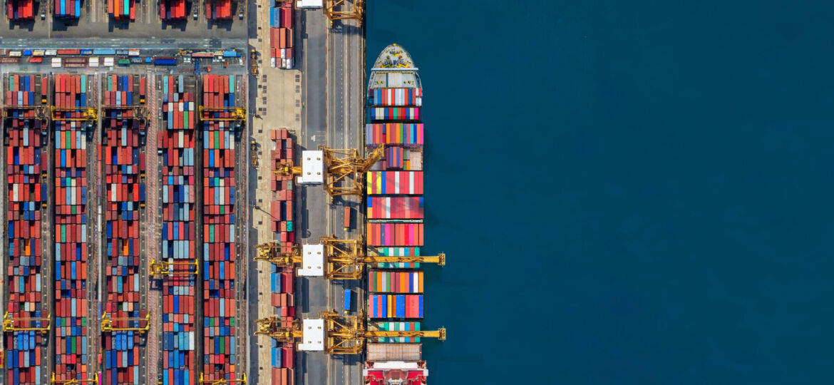Industrial import-export port prepare to load containers. Aerial