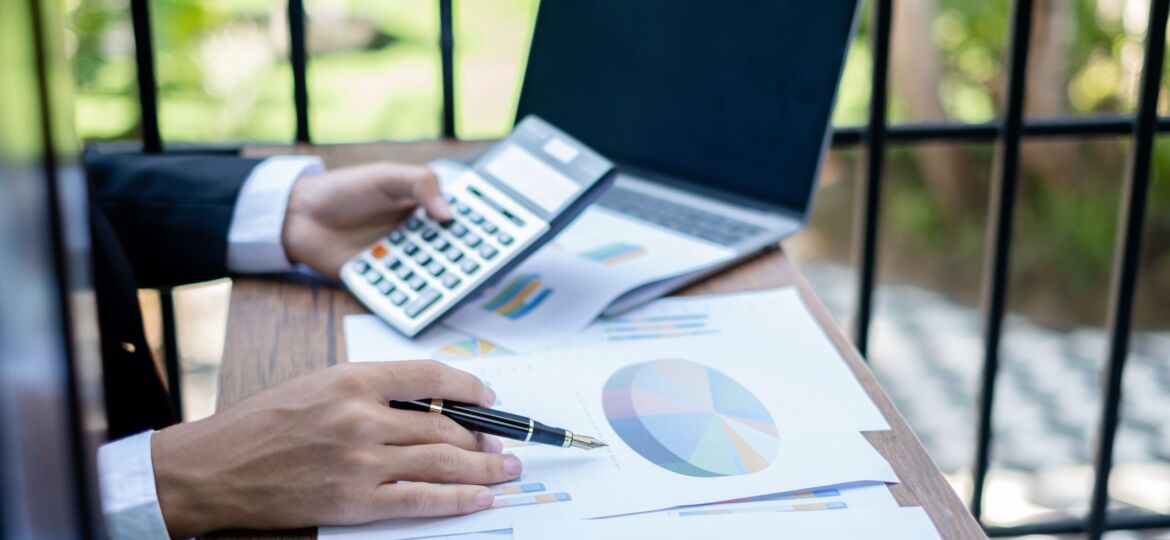 Young businessman financial market analyst sits at their desks a
