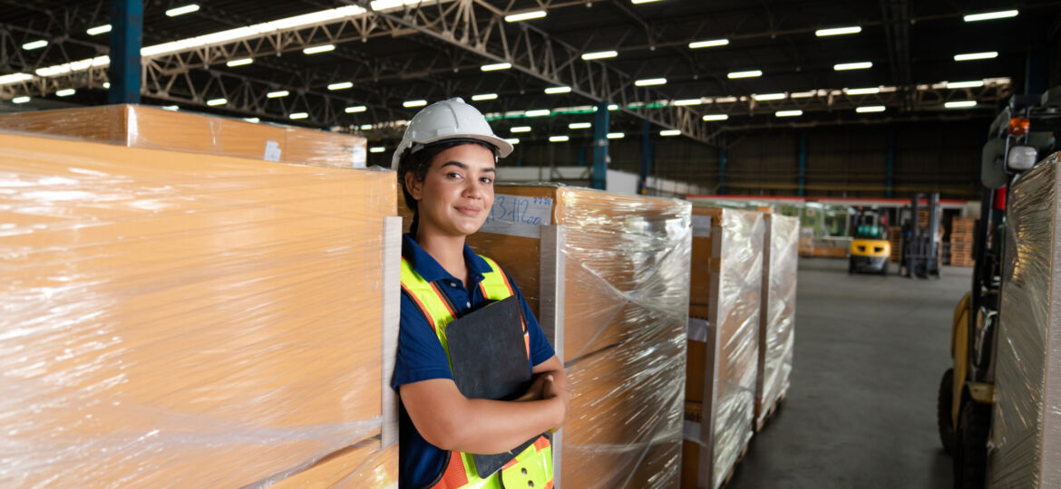 Women warehouse employee worker enjoy working in warehouse.